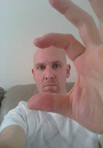 bald-paul-holding-head